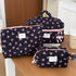1PC Pink Strawberry Women Cosmetic Quilted Bag trio on a table, showcasing stylish storage solutions for cosmetics.