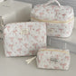 1PC Pink Strawberry Women Cosmetic Quilted Bag with pink bow designs and zipper closures, perfect for cosmetic storage.