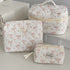 1PC Pink Strawberry Women Cosmetic Quilted Bag with pink bow designs and zipper closures, perfect for cosmetic storage.