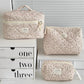 1PC Pink Strawberry Women Cosmetic Quilted Bag displayed in three sizes on a white shelf with storage boxes.