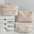 1PC Pink Strawberry Women Cosmetic Quilted Bag displayed in three sizes on a white shelf with storage boxes.