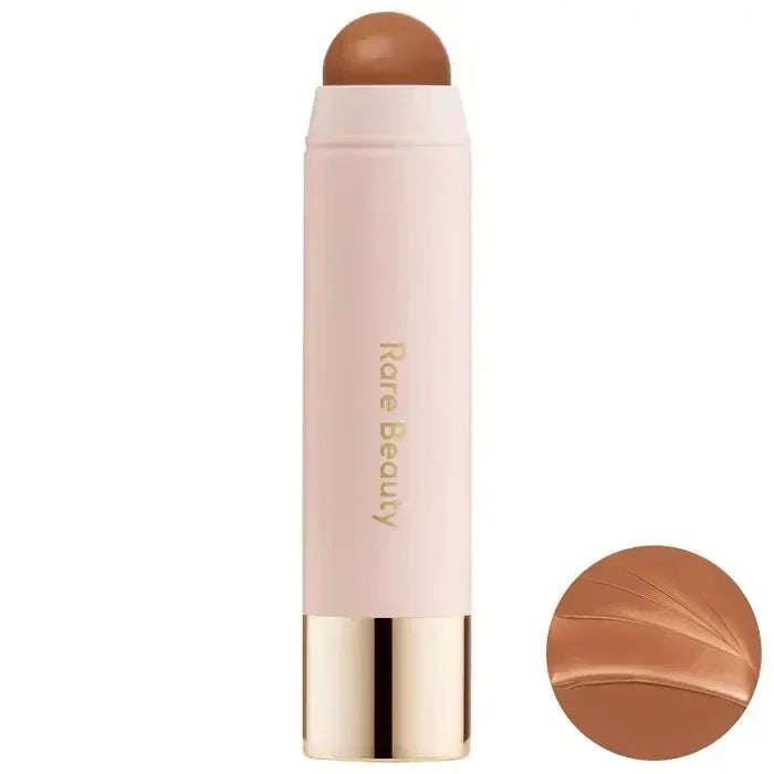 Rare Beauty Liquid Blush stick in a light pink tube, showcasing the warm brown shade on top.