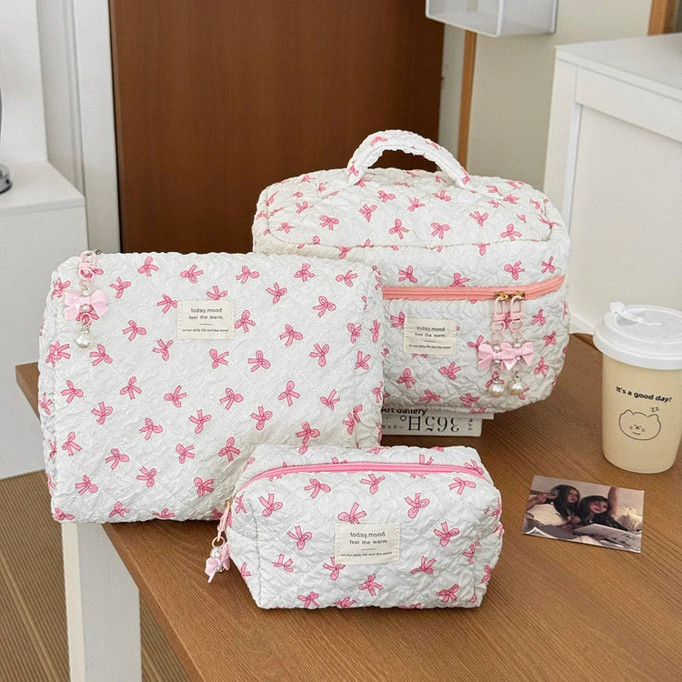 1PC Pink Strawberry Women Cosmetic Quilted Bag in a stylish arrangement on a table.