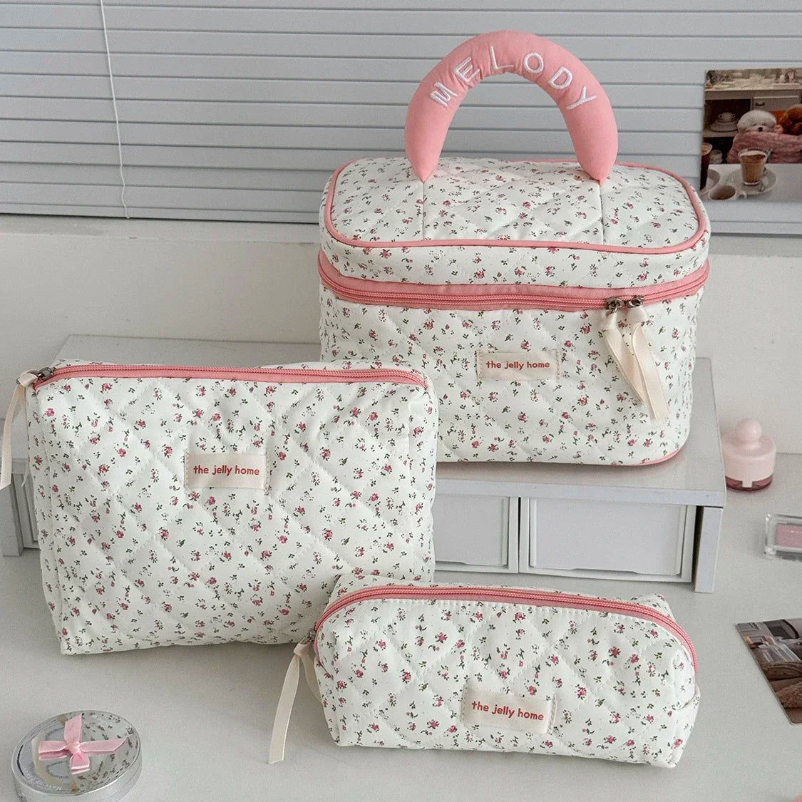 1PC Pink Strawberry Women Cosmetic Quilted Bag in floral design with pink accents and handle.